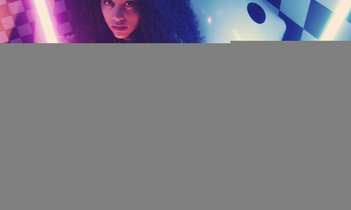 Urban girls between bars of colored light